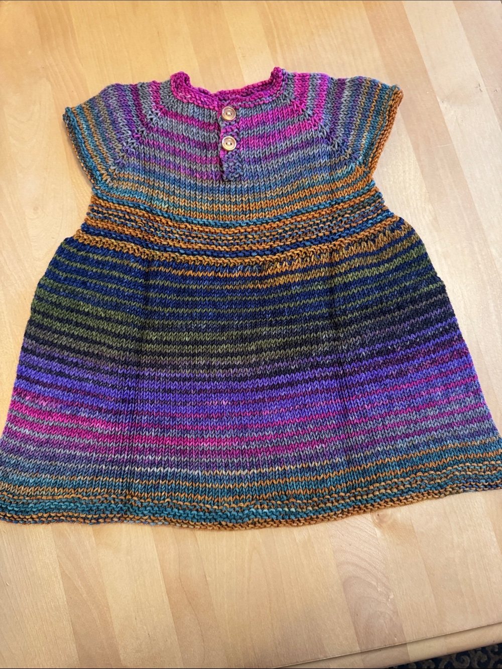 Vibrant handmade  multi-colored hand knit infant short sleeve dress